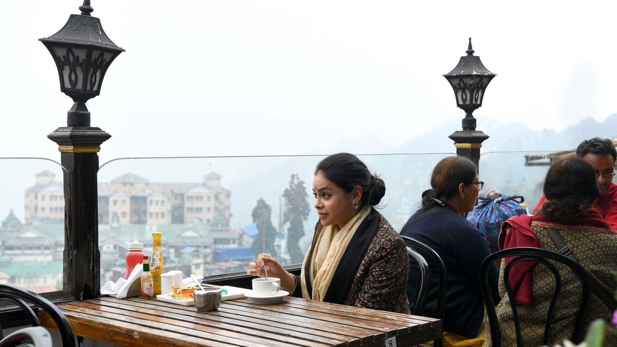 Sumona enjoying enjoying coffee and baked treats at Glenary's, an iconic patisserie off Mall Road in Darjeeling. 