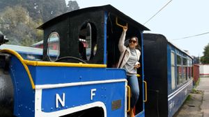 Sumona relives childhood days posing in a toy train at the Ghum Station Museum.