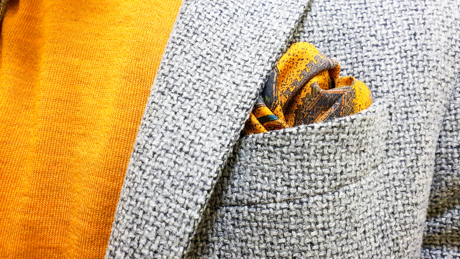 Yellow and orange polo combined with a pocket square