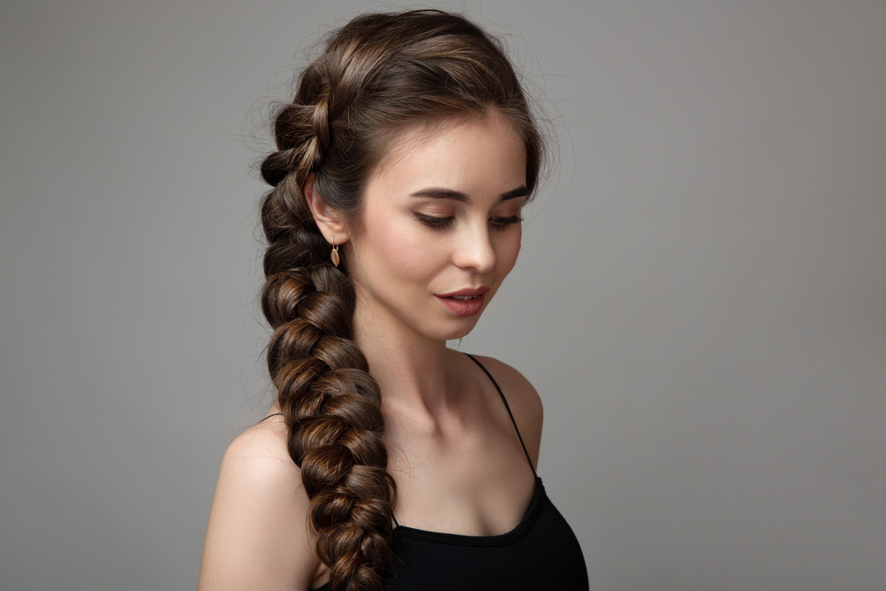 Portrait cute woman on gray