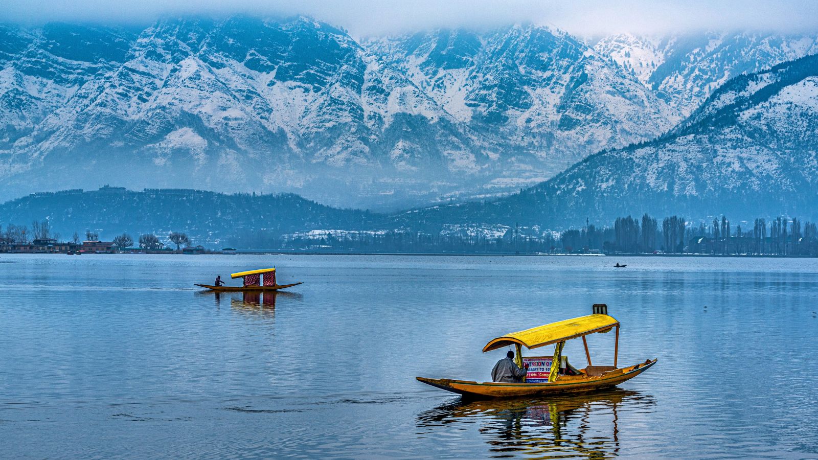 Beautiful golden sunset view of Dal lake at Srinagar, Jammu and Kashmir.  Teal & orange wallpaper view with traditional Kashmiri Shikhara/boat.  Serene scene of Kashmir. Boating, recreation, fun. Stock Photo | Adobe